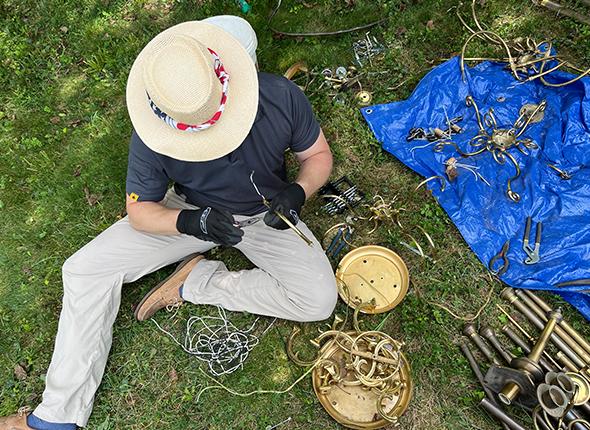 Bell Festival volunteer sorts through collected metals recovered from parks and rivers